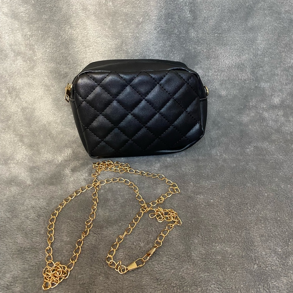 Small black purse with detachable gold chain